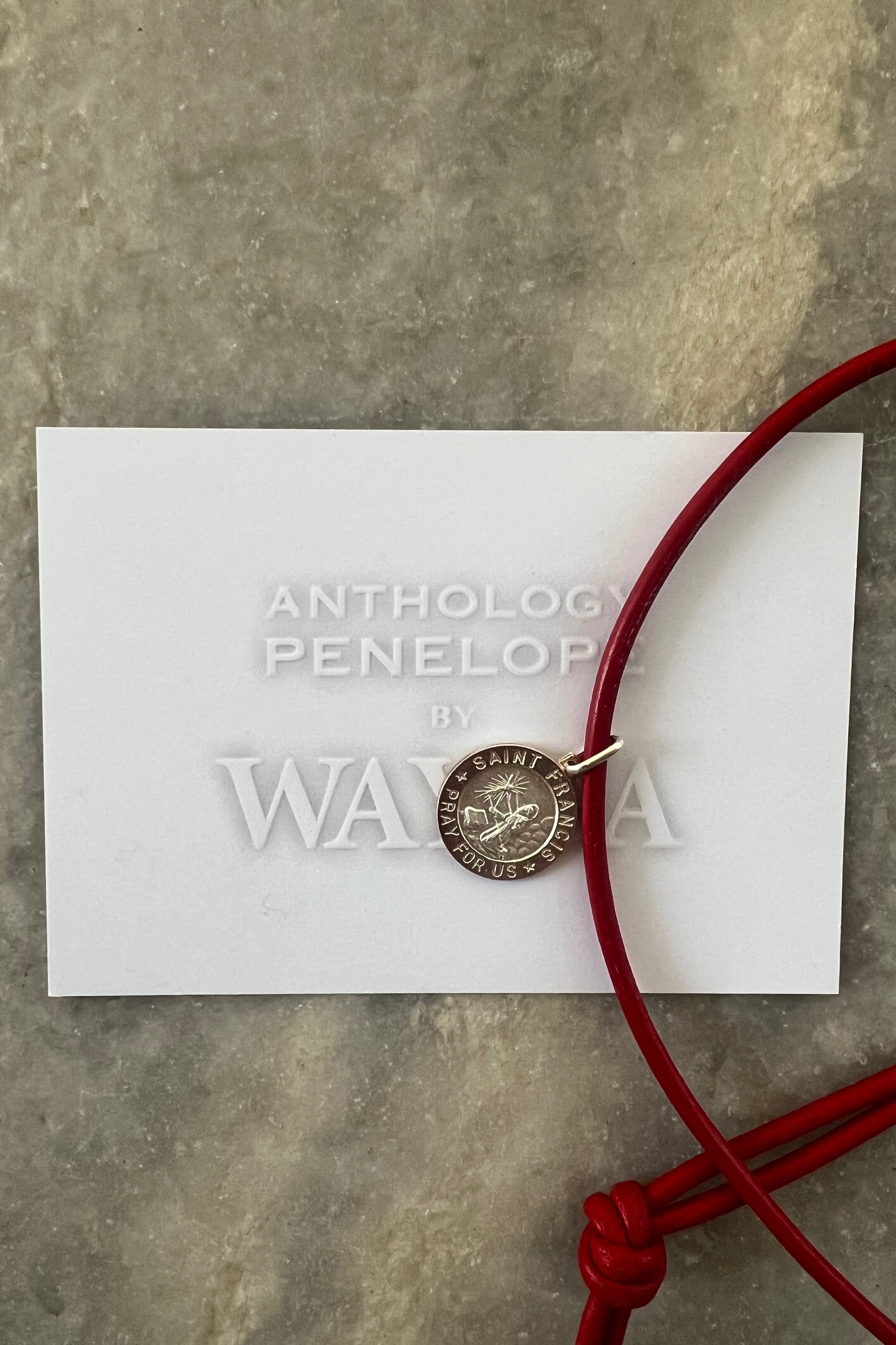 ANTHOLOGY PENELOPE necklace with red leather strap, St. Francis pendant in sterling silver.